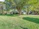 Spacious front lawn with mature shade trees surrounds this lovely ranch-style home at 726 Coach Rd, Indianapolis, IN 46227