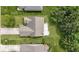 Overhead photo of the home showing roof, lawn, and deck with patio furniture at 7335 Pymbroke Dr, Fishers, IN 46038
