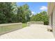 A view of the back deck showing the wood finish, railings, and access to the yard at 7335 Pymbroke Dr, Fishers, IN 46038