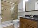 Bathroom features a walk-in shower, vanity with granite countertop and storage cabinet at 7335 Pymbroke Dr, Fishers, IN 46038