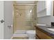 Updated bathroom featuring a glass shower, tiled walls, and modern vanity at 7335 Pymbroke Dr, Fishers, IN 46038
