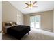 Bedroom with plush carpeting, a ceiling fan, and sliding doors to the outdoors at 7335 Pymbroke Dr, Fishers, IN 46038