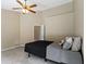 Cozy bedroom with a ceiling fan and a comfortable bed, ideal for relaxation at 7335 Pymbroke Dr, Fishers, IN 46038
