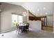 Cozy dining area with a modern light fixture and large window bringing in natural light at 7335 Pymbroke Dr, Fishers, IN 46038