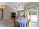 Open-concept dining area with a view of the living room and access to the outdoor patio at 7335 Pymbroke Dr, Fishers, IN 46038