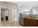 Open kitchen with granite countertops and stainless steel dishwasher and sink at 7335 Pymbroke Dr, Fishers, IN 46038