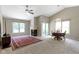 Cozy living room with a fireplace, vaulted ceiling, and a ceiling fan at 7335 Pymbroke Dr, Fishers, IN 46038