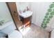 Cozy bathroom with a sink, toilet, and shower with an appealing patterned shower curtain at 829 Waldemere Ave, Indianapolis, IN 46241