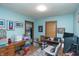 Cozy bedroom with blue walls, functional desk spaces, and an area for storage and crafting at 829 Waldemere Ave, Indianapolis, IN 46241