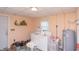 Functional laundry room with washer, dryer, water heater and storage; very practical at 829 Waldemere Ave, Indianapolis, IN 46241