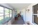 Sunroom with ample natural light, white-painted walls, and a peaceful view of the outdoors at 829 Waldemere Ave, Indianapolis, IN 46241