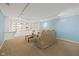 Finished basement featuring built-in bookshelves and cabinets with plenty of room to relax at 8330 Claridge Rd, Indianapolis, IN 46260
