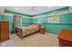 Cozy bedroom with two-tone walls, built-in shelving, and natural lighting at 8330 Claridge Rd, Indianapolis, IN 46260