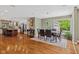 Open concept dining room connecting to a modern kitchen with stainless steel appliances at 8330 Claridge Rd, Indianapolis, IN 46260