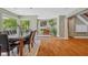 Stylish dining area with hardwood floors, large windows and a step-up to the foyer at 8330 Claridge Rd, Indianapolis, IN 46260