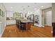 A spacious kitchen features white cabinets, a center island with seating, and stainless-steel appliances at 8330 Claridge Rd, Indianapolis, IN 46260
