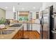 Modern kitchen featuring stainless steel appliances, granite counters, and white cabinetry with ample storage space at 8330 Claridge Rd, Indianapolis, IN 46260