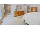 Neutral bedroom featuring a dresser and ensuite bathroom with a walk-in shower at 8330 Claridge Rd, Indianapolis, IN 46260