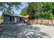 The property has a graveled backyard with privacy fence, outdoor seating, and exercise equipment at 853 S Belleview Pl, Indianapolis, IN 46221