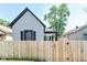 View of backyard with privacy fence and cozy home; perfect for outdoor enjoyment and relaxation at 853 S Belleview Pl, Indianapolis, IN 46221
