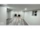 This freshly painted basement features wood-look floors and recessed lighting with laundry hookups at 853 S Belleview Pl, Indianapolis, IN 46221