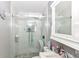 This modern bathroom features a glass enclosed shower with stone flooring and a sleek, undermounted sink at 853 S Belleview Pl, Indianapolis, IN 46221