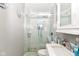 This modern bathroom features a glass enclosed shower with stone flooring and a sleek, undermounted sink at 853 S Belleview Pl, Indianapolis, IN 46221