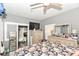This bedroom features soft grey walls, ceiling fan, TV, and two dressers with decor at 853 S Belleview Pl, Indianapolis, IN 46221