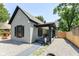 Charming one-story home with gravel landscaping and a covered front porch, providing a welcoming curb appeal at 853 S Belleview Pl, Indianapolis, IN 46221