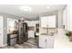 Modern kitchen featuring stainless steel appliances, white cabinets, and stylish countertops for a contemporary feel at 853 S Belleview Pl, Indianapolis, IN 46221