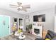 The room showcases a sleek fireplace, TV, and a turquoise entry door at 853 S Belleview Pl, Indianapolis, IN 46221