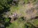Aerial view highlighting debris removal location surrounded by lush greenery and trees at 8581 N Goat Hollow Rd, Mooresville, IN 46158