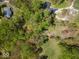 Expansive aerial view of a property featuring wooded areas, homes, and natural surroundings at 8581 N Goat Hollow Rd, Mooresville, IN 46158