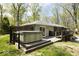 A spacious backyard with a hot tub and deck is perfect for outdoor enjoyment and relaxation at 8581 N Goat Hollow Rd, Mooresville, IN 46158