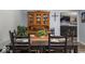 Dining room featuring a wooden table with seating for six, accented with a decorative hutch at 8581 N Goat Hollow Rd, Mooresville, IN 46158
