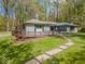 Charming single story home with a spacious front yard and mature trees at 8581 N Goat Hollow Rd, Mooresville, IN 46158