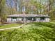 Charming single story home with a spacious front yard and mature trees at 8581 N Goat Hollow Rd, Mooresville, IN 46158