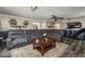 Inviting living room featuring a large sectional sofa, area rug, and a glimpse into adjoining rooms at 8581 N Goat Hollow Rd, Mooresville, IN 46158
