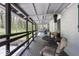 An expansive covered porch with outdoor seating overlooks the lush yard and includes a hot tub at 8581 N Goat Hollow Rd, Mooresville, IN 46158