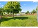 Backyard with green grass and a partial view of a pond at 8635 Nolan Dr, Fishers, IN 46038