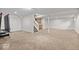 Finished basement with carpet flooring, utility access, kitchenette, and stairs at 8635 Nolan Dr, Fishers, IN 46038