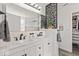 Beautiful bathroom with dual sinks, decorative wall art, and contemporary lighting at 8635 Nolan Dr, Fishers, IN 46038
