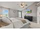 Spacious bedroom featuring vaulted ceilings, neutral walls, and a ceiling fan at 8635 Nolan Dr, Fishers, IN 46038