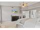 Comfortable bedroom featuring a ceiling fan, carpet floors, and a TV on the wall at 8635 Nolan Dr, Fishers, IN 46038
