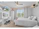 Bright bedroom featuring a desk, closet, ceiling fan, and a window with natural light at 8635 Nolan Dr, Fishers, IN 46038