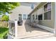 Wooden deck with chairs and a grill, overlooking a spacious yard and pond at 8635 Nolan Dr, Fishers, IN 46038