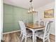 Dining room showcasing wainscoting and modern chandelier at 8635 Nolan Dr, Fishers, IN 46038