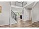 Spacious foyer featuring a staircase, balcony and views into the living room at 8635 Nolan Dr, Fishers, IN 46038