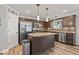 Well-lit kitchen featuring stainless steel appliances, a pantry, and a center island at 8635 Nolan Dr, Fishers, IN 46038