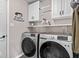 Bright laundry room with modern Samsung washer and dryer appliances at 8635 Nolan Dr, Fishers, IN 46038
